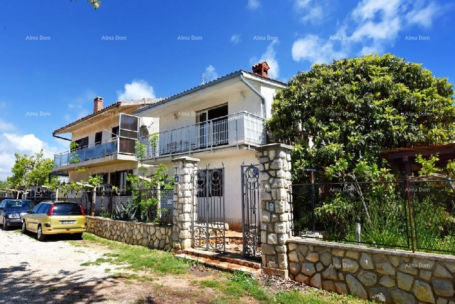 Hose with three apartments and business space