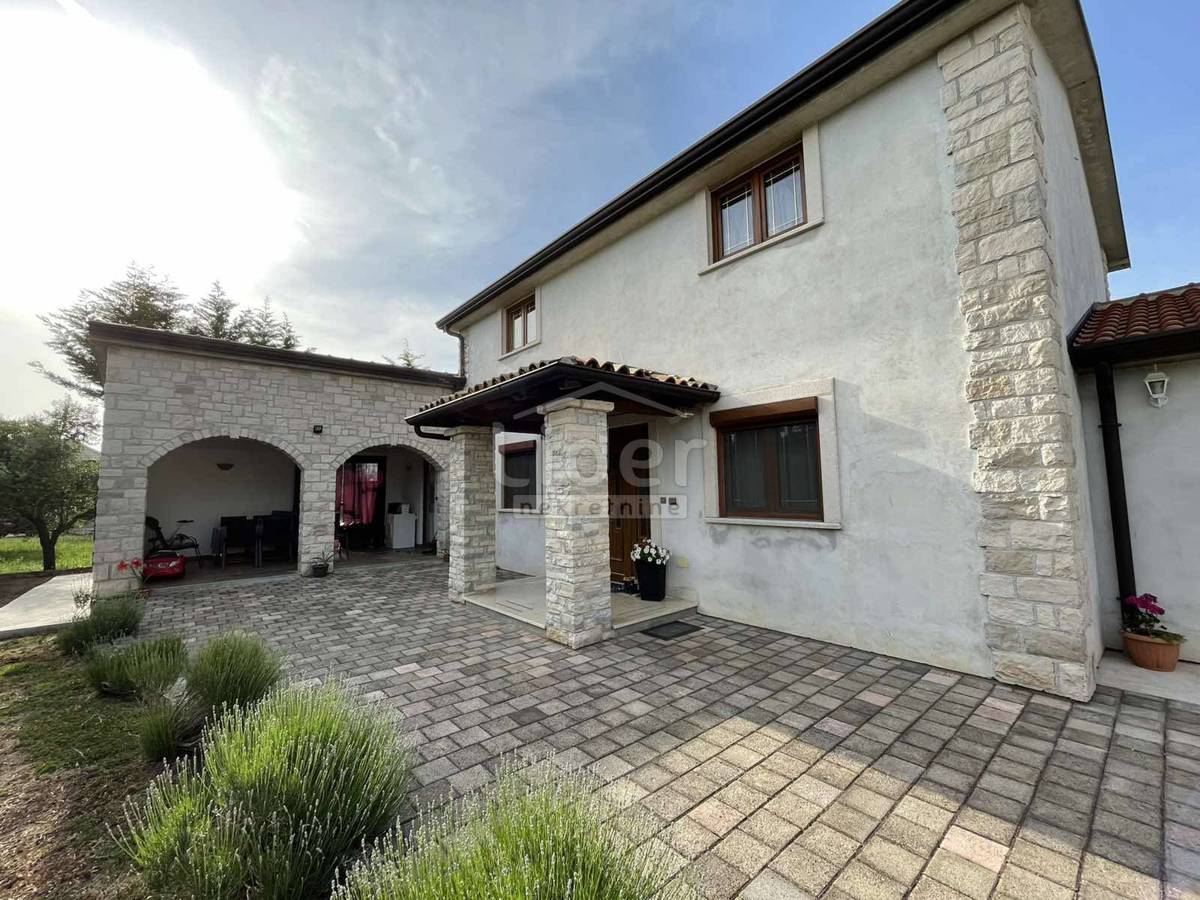 A house with a beautiful garden for sale